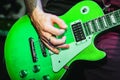 Green guitar string guitar closeup