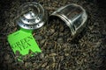 Green Gunpowder Tea with steel strainer and label with text Royalty Free Stock Photo