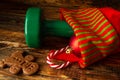 Green gym dumbbell in a stocking for Christmas present. Royalty Free Stock Photo