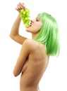 Green hair girl with a bunch of grapes Royalty Free Stock Photo