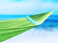 Green hammock hanging in the coast