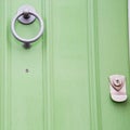 green handle in london antique brown door rusty brass nail an Royalty Free Stock Photo