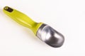 Green handled single-piece ice cream scoop Royalty Free Stock Photo