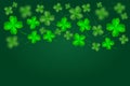 Green Happy Saint Patrick`s Day background. Abstract bright and blurry luck clovers backdrop template.
