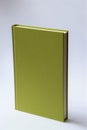 Green hardcover book with white background