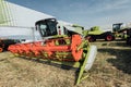 Green harvester in a field at an agricultural exhibition in summer