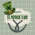 A green hat with a clover and the iron horseshoe for good luck. Greeting inscription St. Patrick s Day. Isolated on