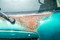 Green hatchback car back or fifth door damaged rusty and corroded paint spots Royalty Free Stock Photo