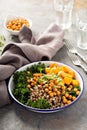 Green and healthy grain bowl with roasted chickpeas