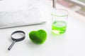 Green heart concept. Health Care researchs equipments. Green heart with a chemical organic test rube. Science glasses on laptop Royalty Free Stock Photo