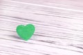 Green heart of felt on a white gray wooden background. Valentine Day.Greeting card.Wedding, Royalty Free Stock Photo