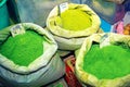 Green henna powder in bags, on souk market in Muscat Royalty Free Stock Photo