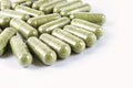 Green herbal medicine capsule isolated