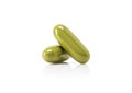 Green herbal supplement capsule isolated on white