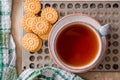 Green herbal tea is served on a metal vintage antique retro tray with homemade cakes - round biscuit biscuits. on a wooden backgro Royalty Free Stock Photo