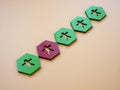 Green hexagons with figures and red one. Impostor syndrome concept. Royalty Free Stock Photo