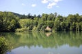 Green hill and lake reflection landscape Royalty Free Stock Photo