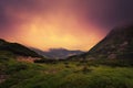 Green hills in clouds after the sunset Royalty Free Stock Photo