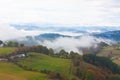 Green hills and mountains in the fog in Tineo, Asturias, Spain Royalty Free Stock Photo