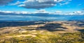 Green hills, olive gardens and small vineyard under rays of morning sun, Italy, Tuscany. Famous Tuscany landscape with curved road Royalty Free Stock Photo