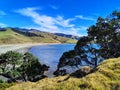 Muriwai wallk. Green Hills and view of the lagoon at at Port Jackson. Coromandel. New Zealand Royalty Free Stock Photo