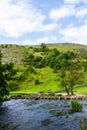 Green Hills, Stepping Stones near River Dove in Peak District Na Royalty Free Stock Photo