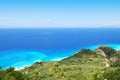 Green hillside and vast blue sea on the island of Lefkada