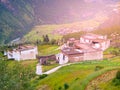 Green hilly landscape of Tibet with small traditional tibetan village Royalty Free Stock Photo