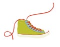 Green hipster youth sneaker with red shoelace isolated Royalty Free Stock Photo