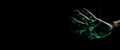 Green hologram of human hand on dark background banner. Generate ai