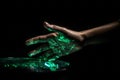 Green hologram of human hand on dark background. Generate ai