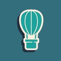 Green Hot air balloon icon isolated on green background. Air transport for travel. Long shadow style. Vector