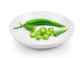 Green hot chili pepper in plate on white background Royalty Free Stock Photo