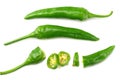 green hot chili peppers with slices isolated on white background top view Royalty Free Stock Photo