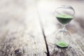 Green hourglass background concept for time or ecology and environmental conservation