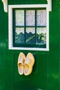 Green house with clogs Royalty Free Stock Photo