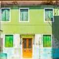 Green house facade in the island of Burano, Venice