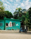Green house with a mural, in Tulum, Mexico