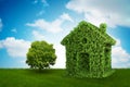 The green house and tree in ecologic living concept - 3d rendering Royalty Free Stock Photo