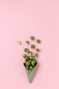 Green ice cream cone with broccoli on pink pastel background Royalty Free Stock Photo