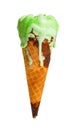 Green ice cream cone melting on white background with clipping path Royalty Free Stock Photo