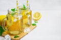 Green ice tea with lemon and mint in a glass jar. Royalty Free Stock Photo