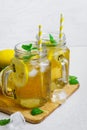 Green ice tea with lemon and mint in a glass jar. Royalty Free Stock Photo