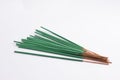 Bunch of green Incense sticks isolated on white background