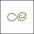 A green infinity symbol with a leaf on a white background Royalty Free Stock Photo