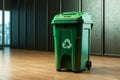 Green initiative recycling bin placed conveniently close to the wall Royalty Free Stock Photo