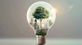 Green Innovation: Buildings and Tree in a Light Bulb for Sustainable Environmental Harmony and Climate Change Royalty Free Stock Photo