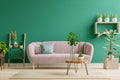 Green interior in modern interior of living room style with soft sofa and green wall Royalty Free Stock Photo