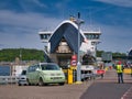 A green, Irish registered VW motor caravan disembarks the CalMac operated roro car ferry Lord of the Isles in Oban, Scotland, UK Royalty Free Stock Photo