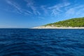 Geen island on blue sea water and sky Royalty Free Stock Photo